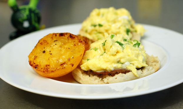Photo of scrambled eggs on an English muffin